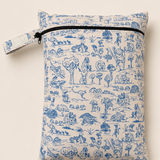 A PUL material zippered daycare wet bag with a blue and beige toile de Jouy pattern featuring Australian outback animals and trees, shown on a light beige background.