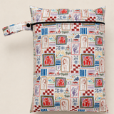 A zippered daycare wet bag with a colourful hand drawn vintage-style illustrated print. A repeating pattern of different abstract drawings with horses, person fishing, campfire, vintage bike with trailer, scorpion and various trees, plants and florals. It features a matching fabric loop strap with a black snap button, set against a solid light beige background.